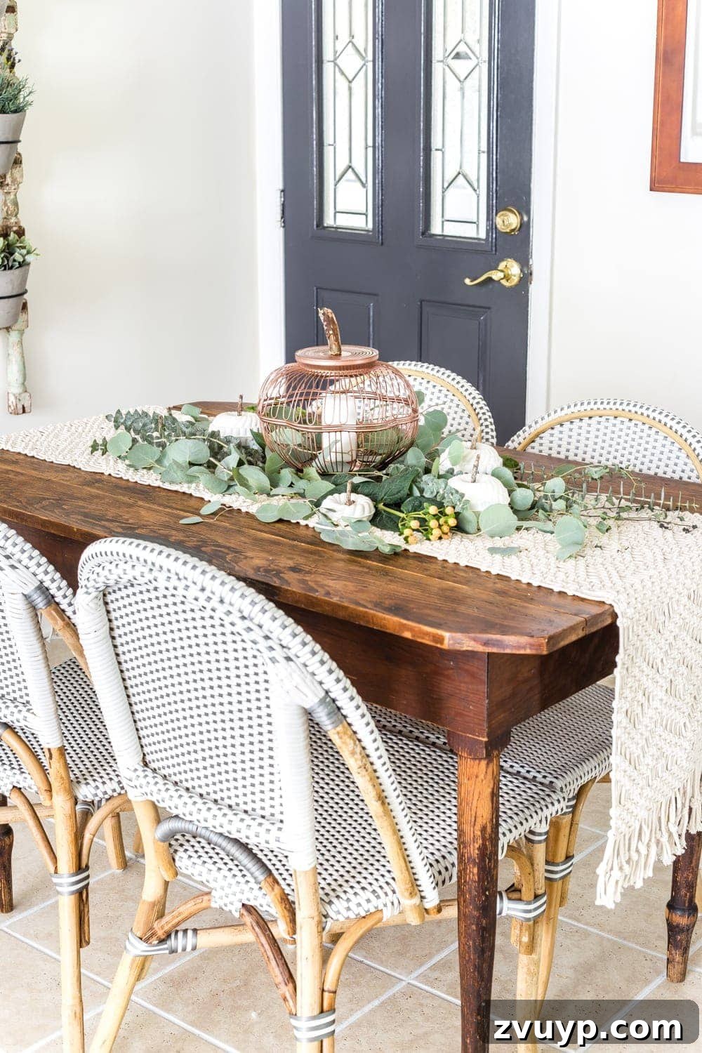 The Unlikely Pumpkin Patch Wire Basket and Bundt Pan Crafts 12 fall centerpiece using thrifted wire bread baskets and DIY craft pumpkins
