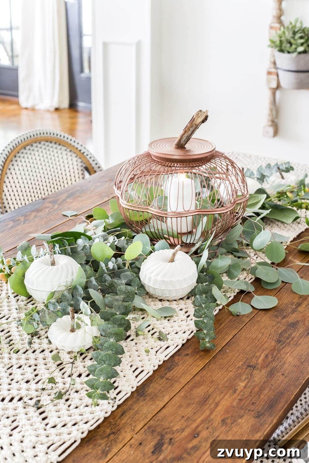 The Unlikely Pumpkin Patch Wire Basket and Bundt Pan Crafts 14 Fall centerpiece with DIY pumpkin lantern using thrifted wire bread baskets and craft pumpkins using mini bundt pan Jello molds
