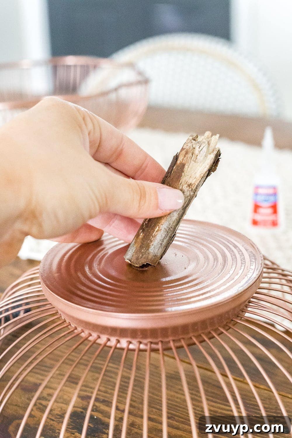 The Unlikely Pumpkin Patch Wire Basket and Bundt Pan Crafts 6 DIY pumpkin using wire bread baskets and sticks from your yard