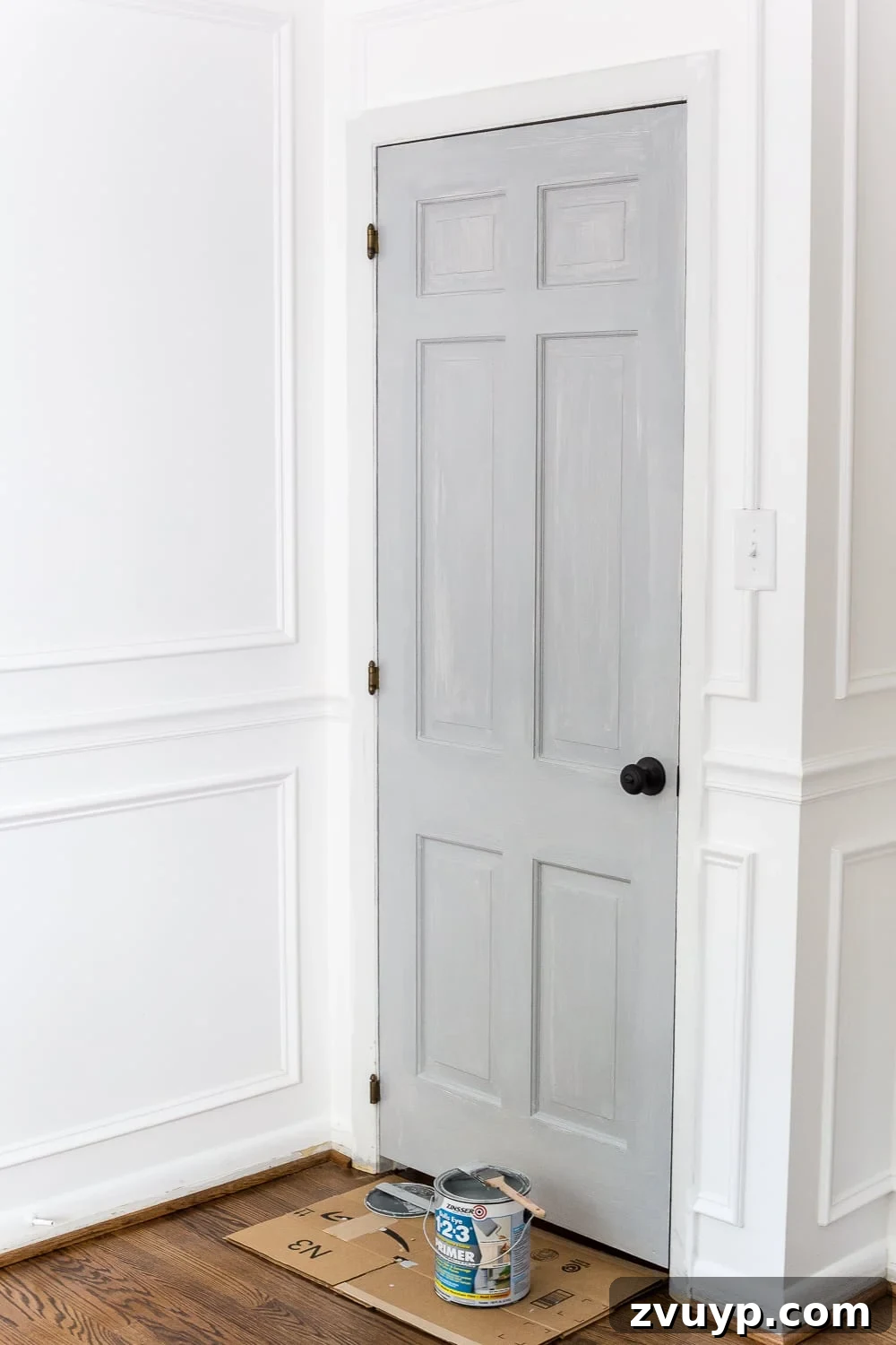 Mastering Door Painting for Unrivaled Durability 19 painting a door with tinted primer, close-up