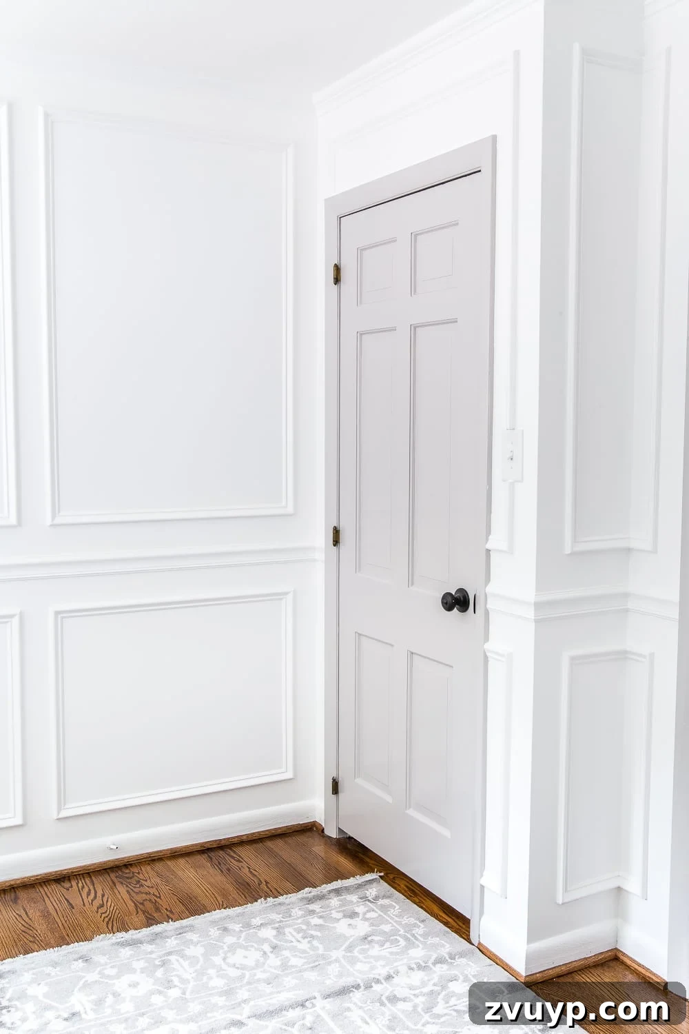 Mastering Door Painting for Unrivaled Durability 20 gray painted door with white walls and picture frame molding in a nursery