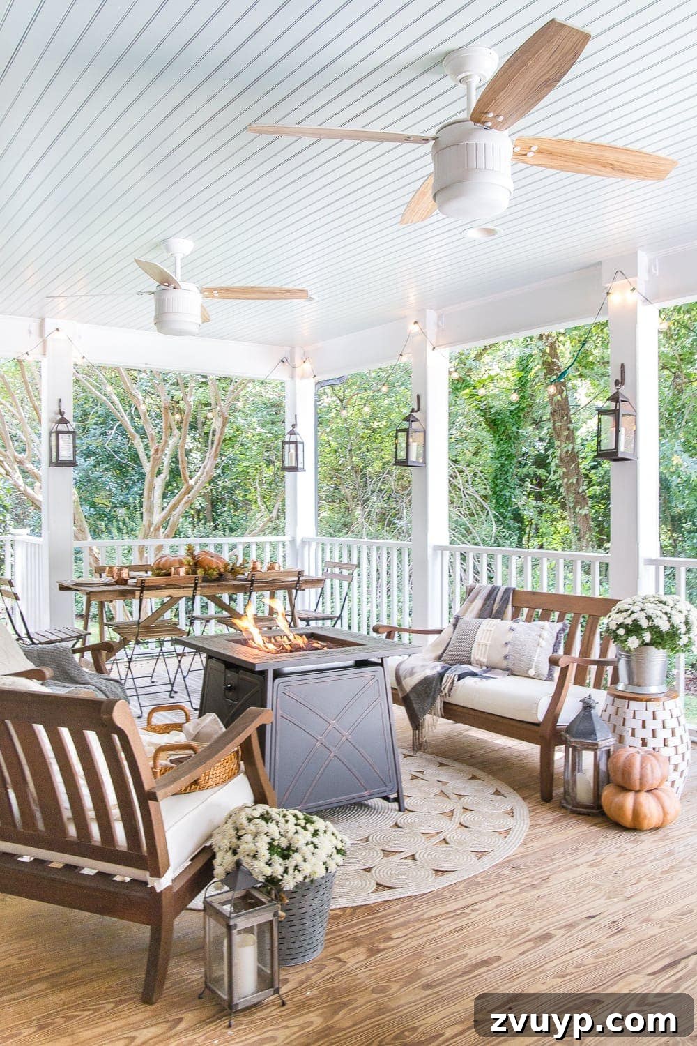 Autumn Porch Retreat: Crafting Cozy Outdoor Style 2 Cozy fall porch with pumpkins, a gas fire pit, lanterns and string lights