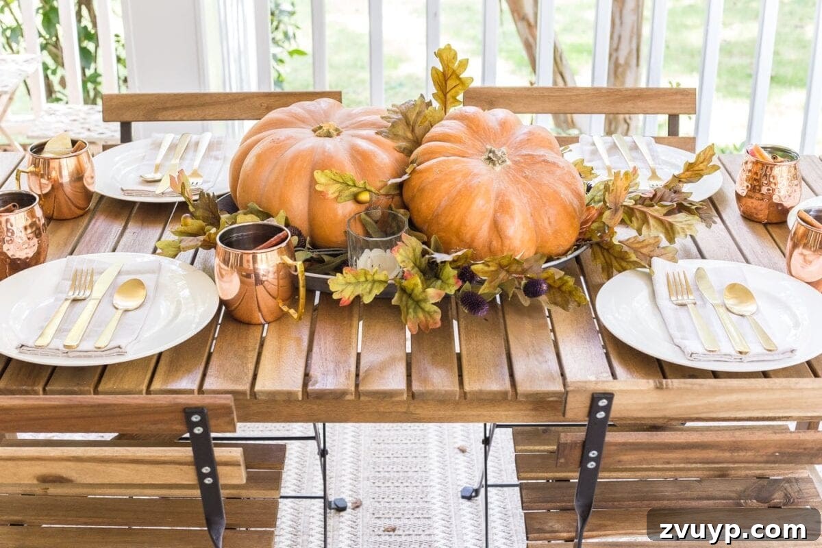 Autumn Porch Retreat: Crafting Cozy Outdoor Style 14 cozy fall porch with outdoor dining and simple pumpkin centerpiece