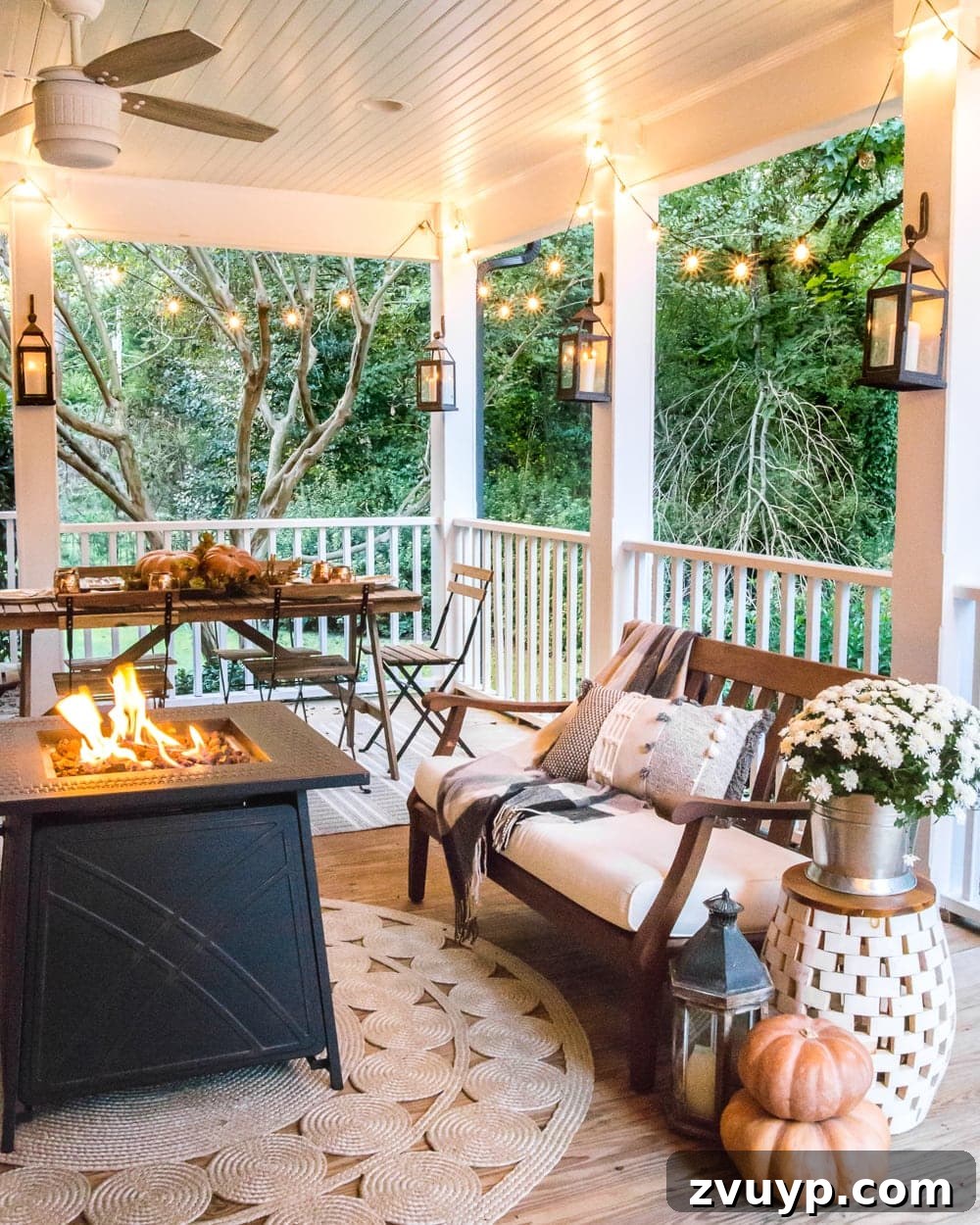 Autumn Porch Retreat: Crafting Cozy Outdoor Style 18 cozy fall porch with fire pit, string lights, and lanterns