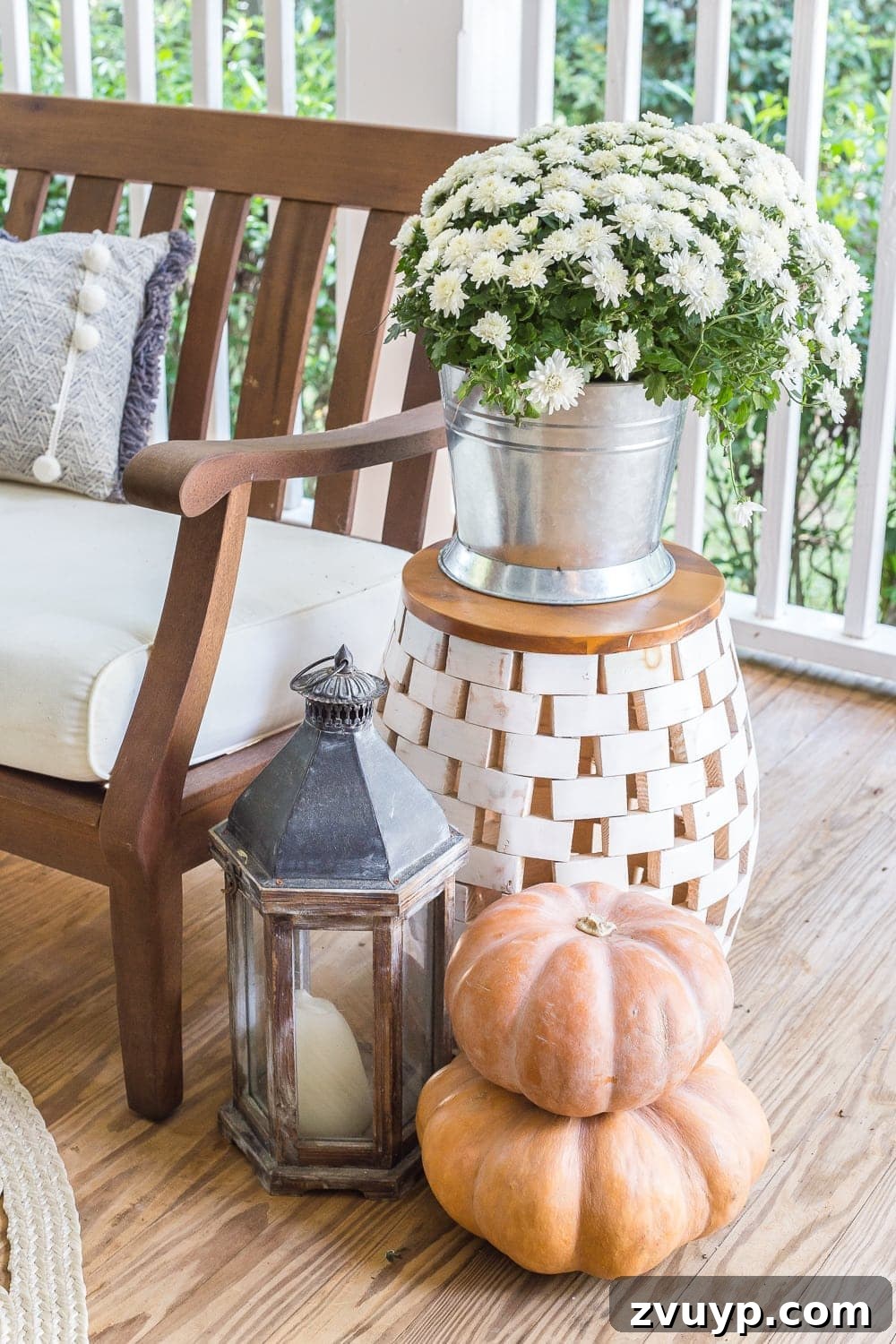Autumn Porch Retreat: Crafting Cozy Outdoor Style 7 cozy fall porch with lanterns, mums, and pumpkins