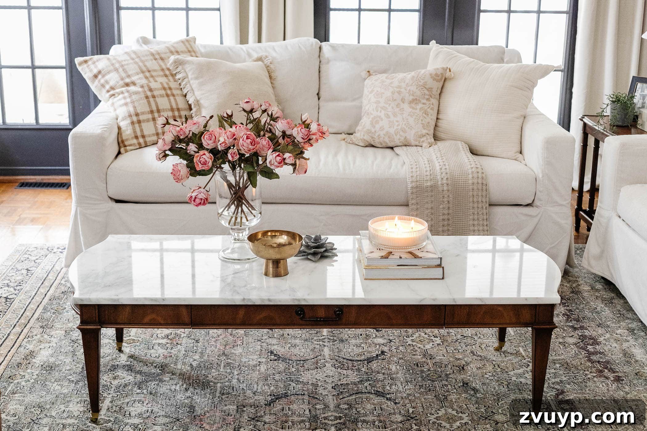 Mix and match throw pillows on a sofa in a stylish living room