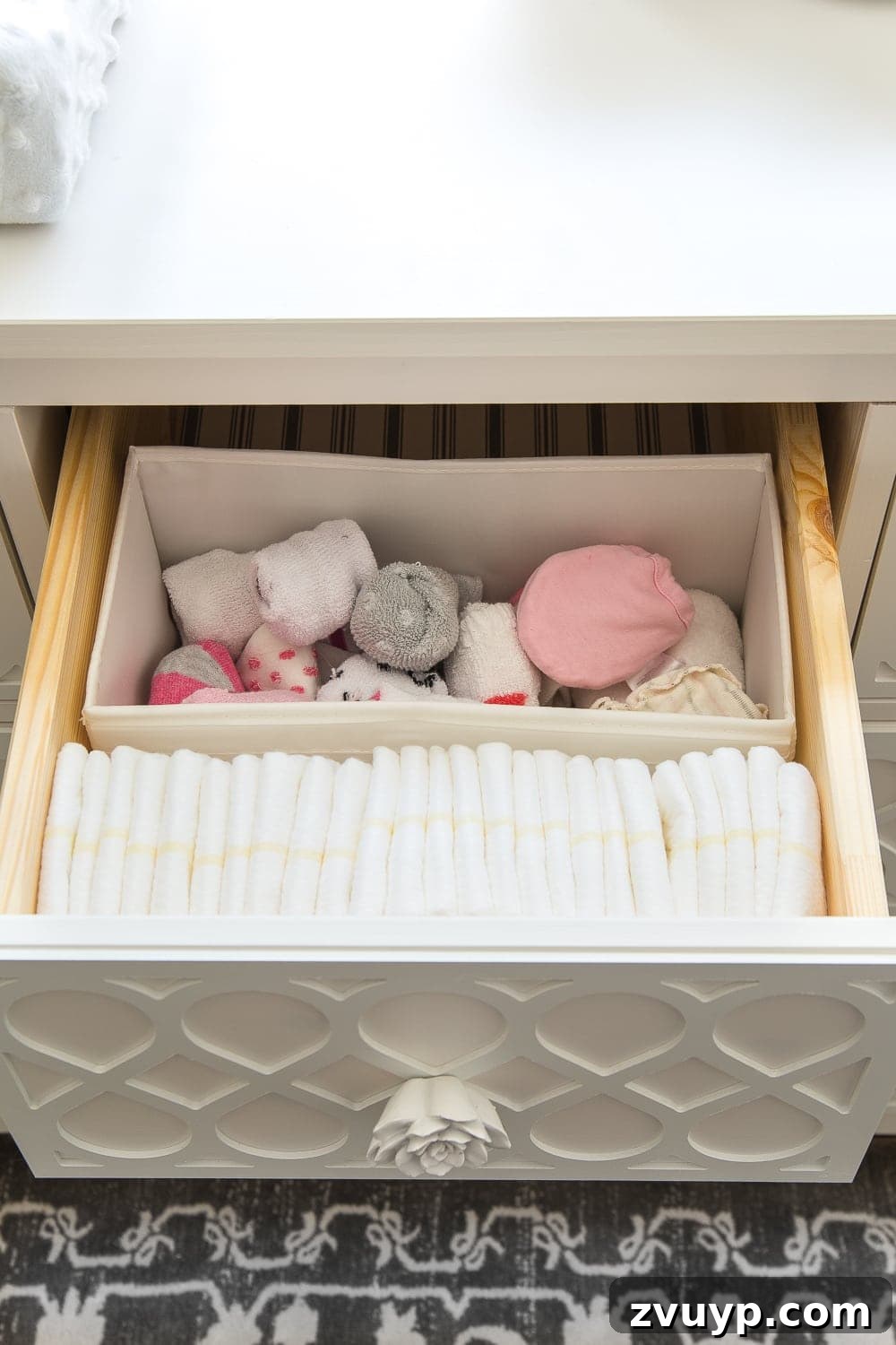 Inside Our Perfectly Organized Nursery 11 Nursery Organization | Dresser drawers with dividers to store a mix of disposable diapers, socks, and mittens