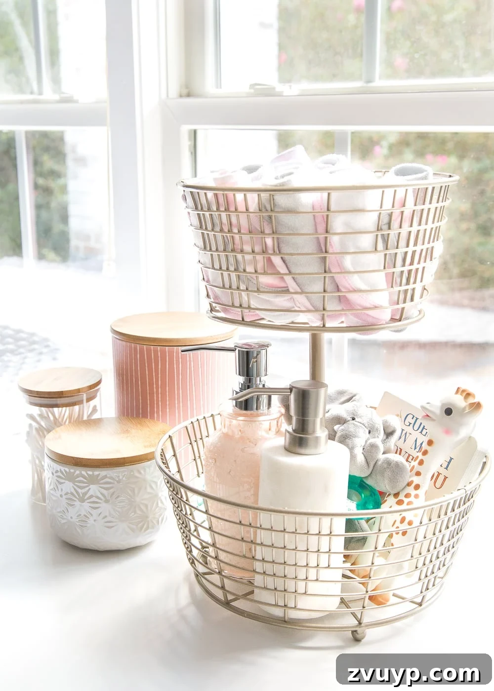 Inside Our Perfectly Organized Nursery 7 Nursery Organization | Utilize a tiered fruit basket for easy access to baby washcloths, grabby toys, Wubbanubs, lotion, and hand sanitizer during diaper changes