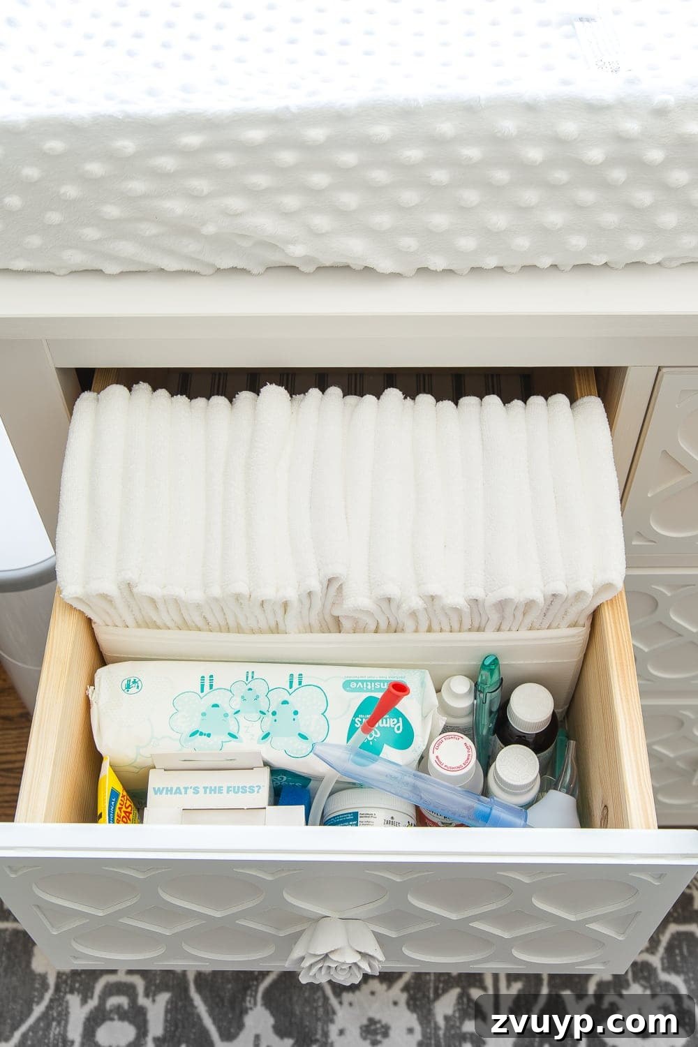 Inside Our Perfectly Organized Nursery 9 Nursery Organization | Dresser drawers with dividers to efficiently store cloth diaper liners, baby medicines, aspirator, thermometer, diaper cream, and wipes