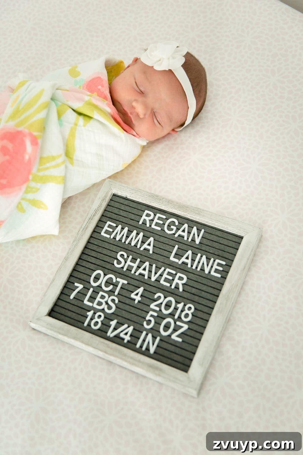 Regans Birth The Day We Became Four 2 Newborn baby Regan Emma Laine Shaver sleeping peacefully, wrapped in a blanket
