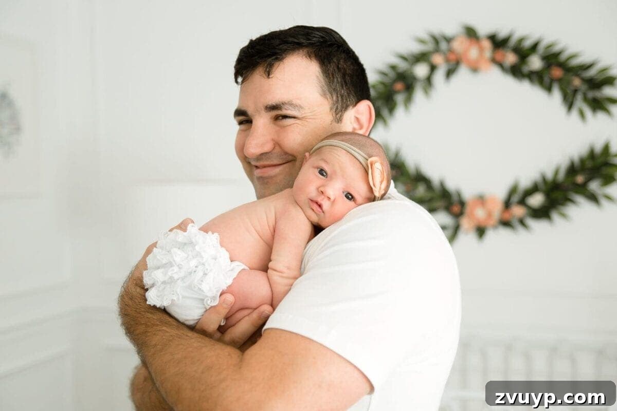Regans Birth The Day We Became Four 12 Proud father Robert holding baby Regan close, looking at her with adoration