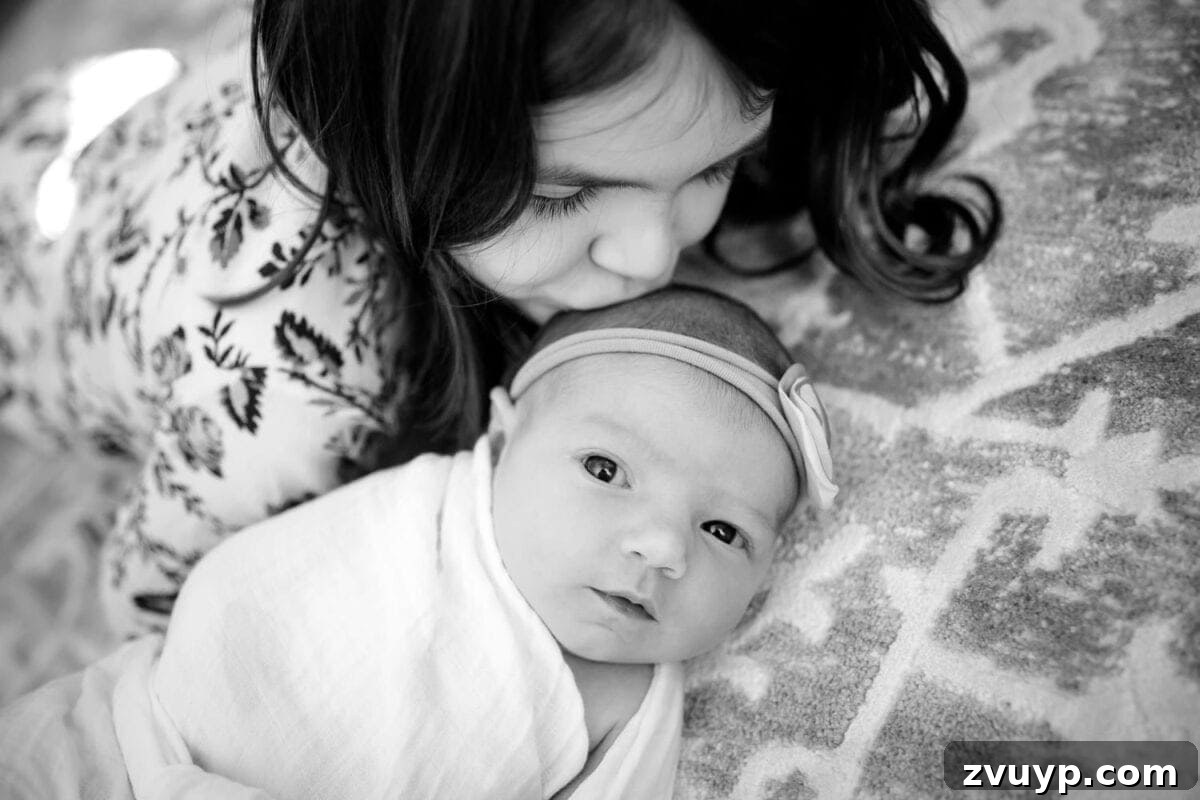 Regans Birth The Day We Became Four 3 Close-up of newborn baby Regan Shaver's delicate facial features, eyes closed