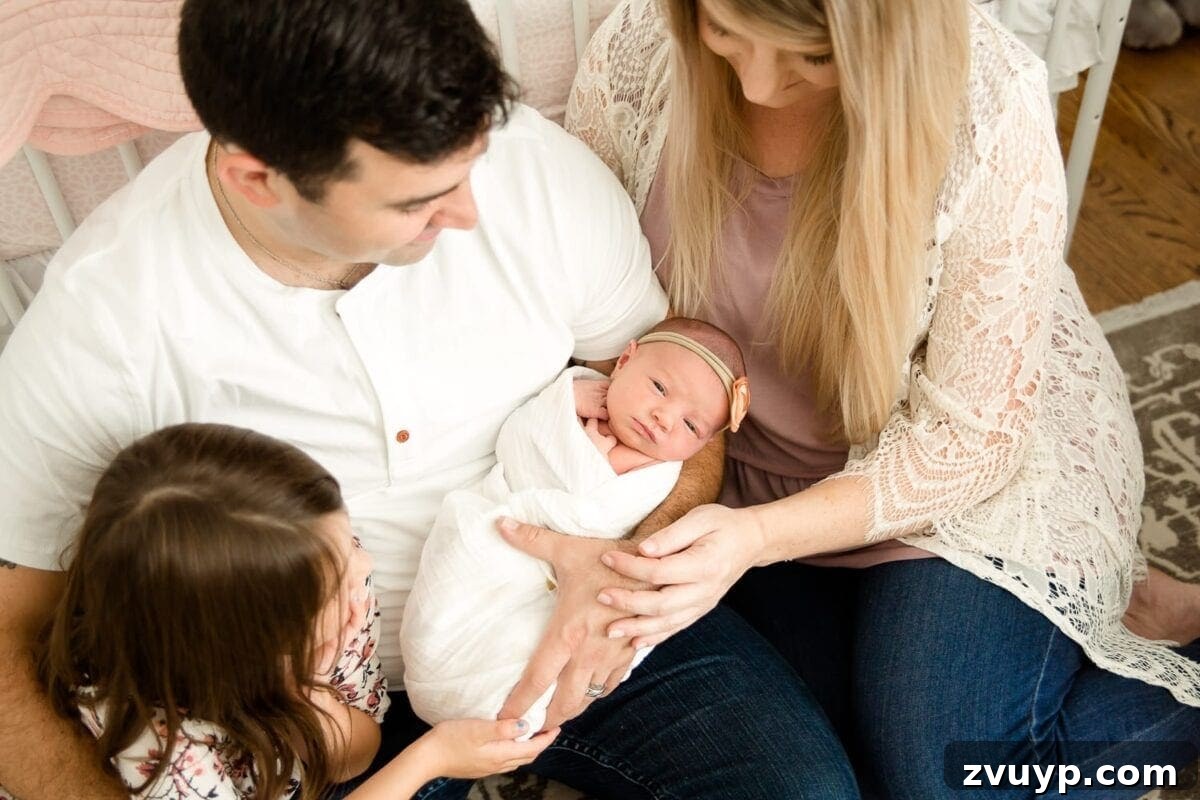 Regans Birth The Day We Became Four 10 New parents gazing lovingly at their newborn baby in the hospital bed