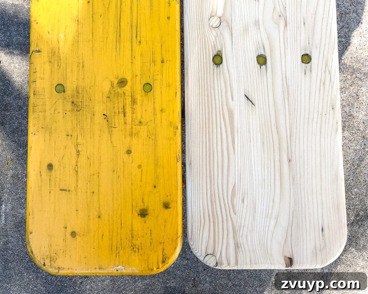 Close-up of the sanded wood surface on the antique beer garden bench, ready for staining