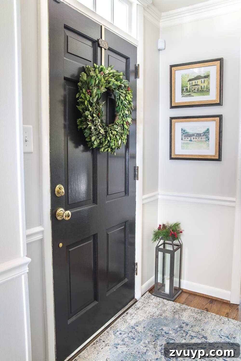 Festive Home Tours 2018 2 Our cozy foyer entrance adorned with Christmas garland and framed family memories, featuring vintage-style decor.