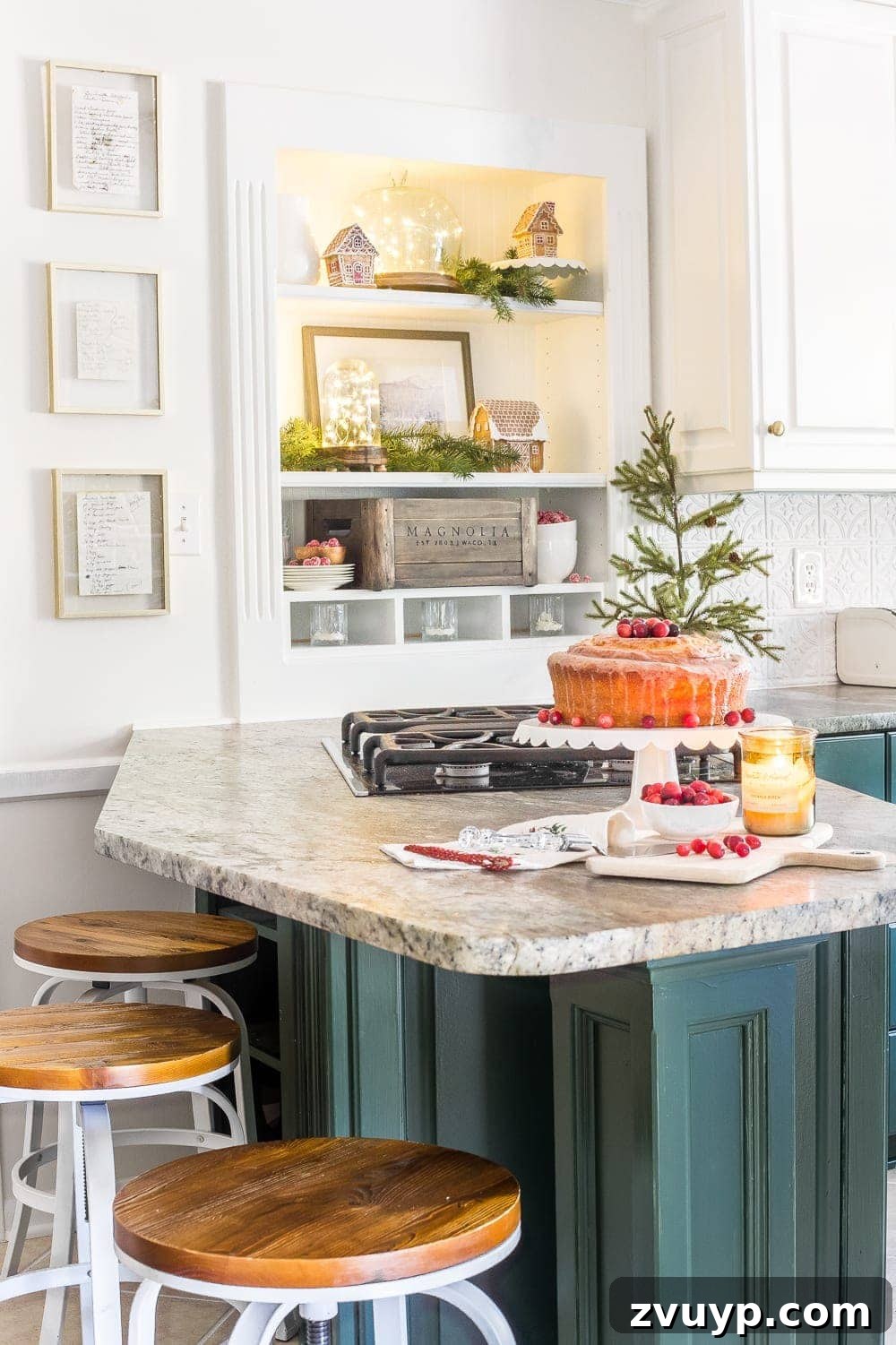Festive Home Tours 2018 18 Open kitchen shelves styled with Christmas decor, including vintage-inspired plates, candles, and seasonal accents.