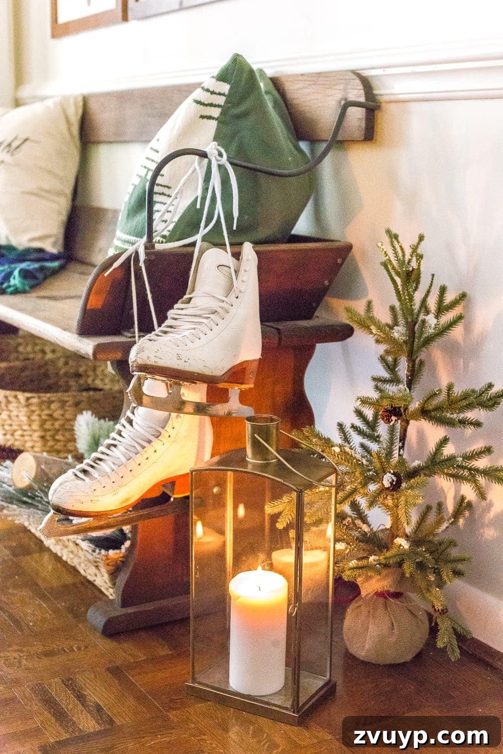 Festive Home Tours 2018 23 A unique Christmas decoration in the entryway: vintage ice skates hung with greenery, adding a rustic and whimsical touch.