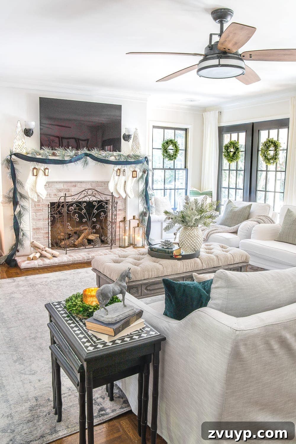 Festive Home Tours 2018 25 A warm and cozy living room scene at night, with the Christmas tree lights glowing and soft ambient lighting, perfect for quiet moments.