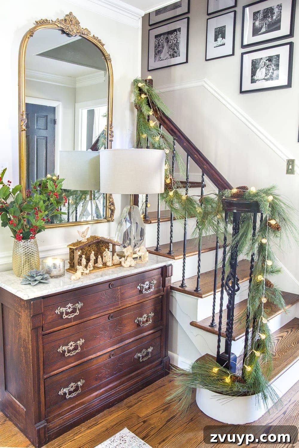 Festive Home Tours 2018 4 Close-up of a vintage marble-topped Eastlake chest in the foyer, displaying a traditional nativity scene and family photos.