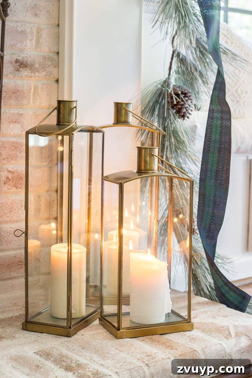 Festive Home Tours 2018 33 A close-up of a festive candle arrangement on a coffee table, adding warmth and a cozy glow to the living room decor.
