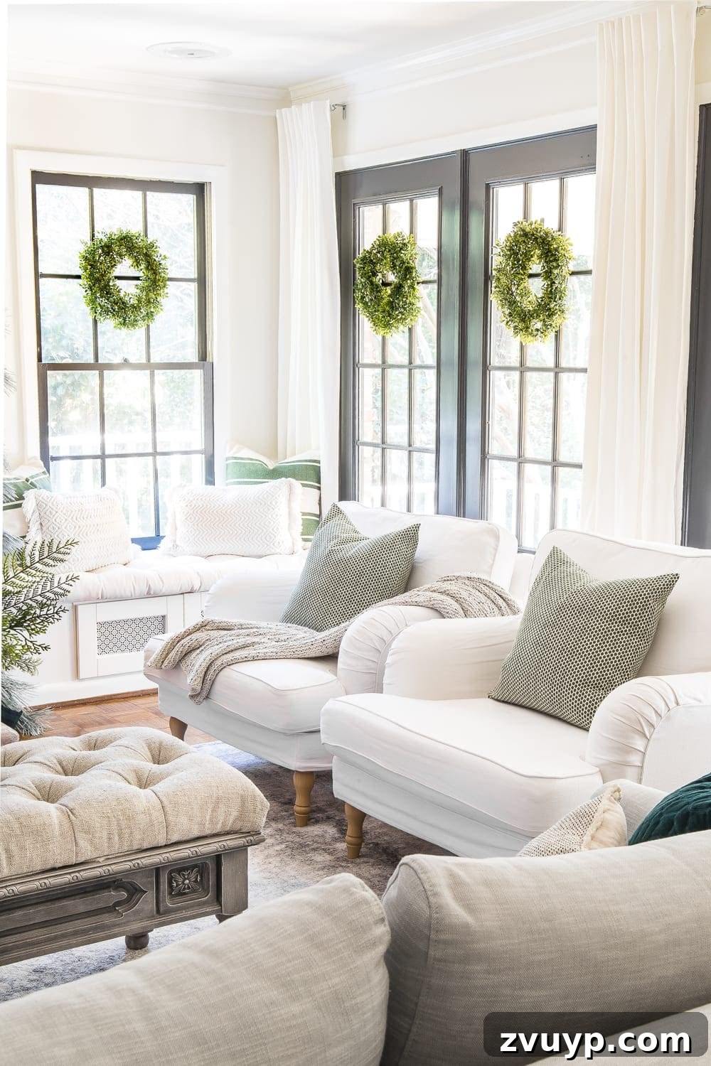 Festive Home Tours 2018 36 A cozy corner of the living room with a decorated Christmas tree, comfortable seating, and festive pillows.