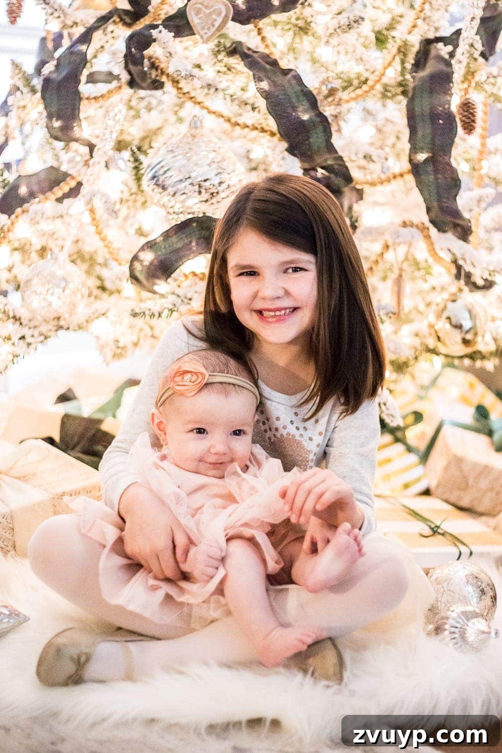 Cozy Christmas Captures: Easy DIY Family Photos at Home 13 Beautiful family Christmas photos taken in front of a festive tree, showcasing sharp focus and soft, enchanting lighting