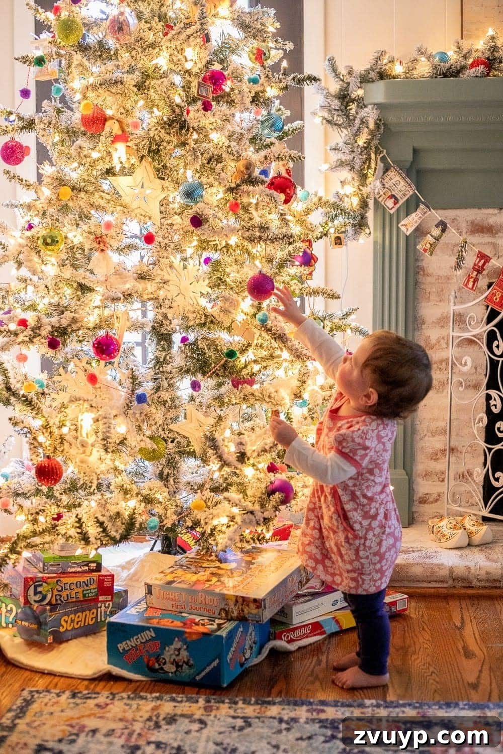 Cozy Christmas Captures: Easy DIY Family Photos at Home 4 Kids taking family portraits in front of a tree, expertly positioned to face into the natural light for a perfect, soft glow