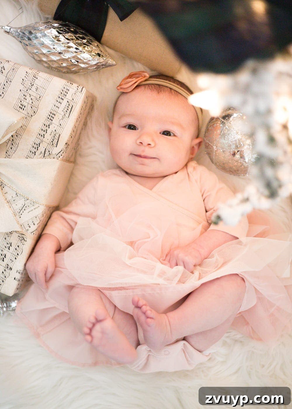 Cozy Christmas Captures: Easy DIY Family Photos at Home 10 Framing beautiful family photos beside a Christmas tree, focusing on eye-level composition and flattering angles