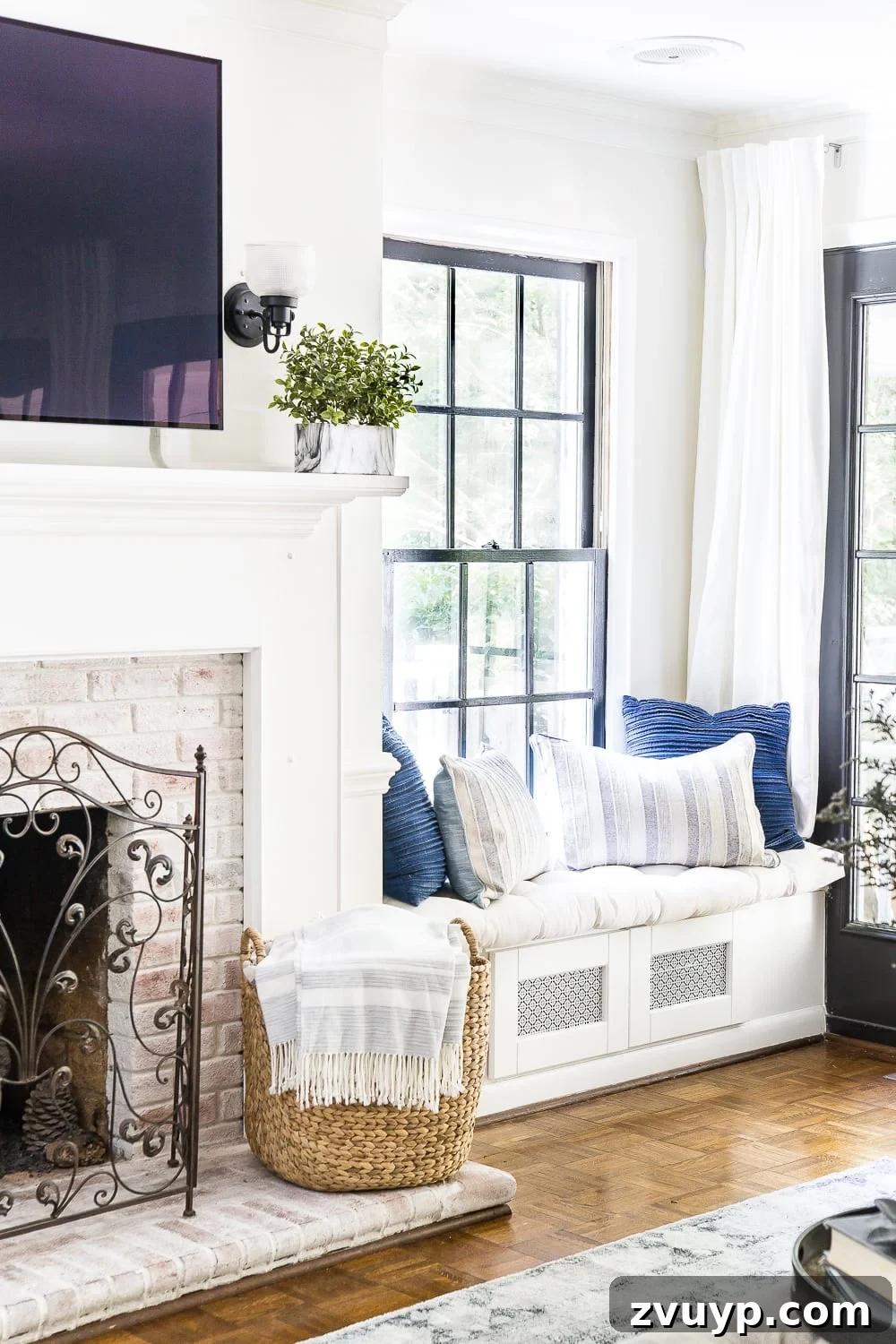Unlock Your Unique Decorating Aesthetic 3 Cozy living room with neutral tones, blue accents, and a blend of natural textures