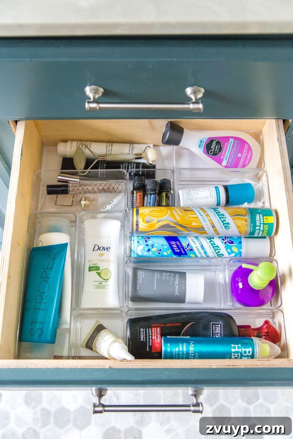 From Mess to Marvel: 6 Steps to a Perfect Bathroom Vanity 12 Woman's Skincare and Haircare Drawer Organization - A dedicated drawer organized with various skincare and haircare products for personal use.