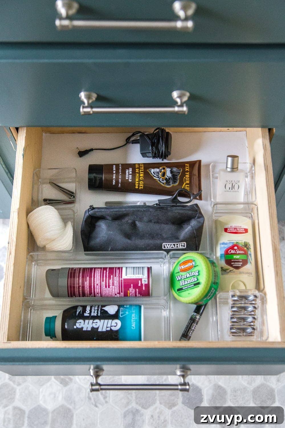 From Mess to Marvel: 6 Steps to a Perfect Bathroom Vanity 13 Man's Grooming and Shaving Supplies Drawer Organization - A drawer neatly arranged with men's shaving cream, razors, and other grooming items.