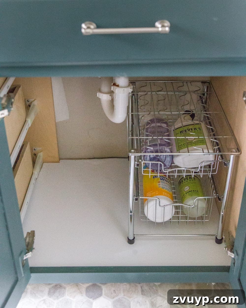 From Mess to Marvel: 6 Steps to a Perfect Bathroom Vanity 7 Clean and Lined Bathroom Drawer After Contact Paper Installation - A pristine bathroom drawer with new wood grain contact paper, ready for organization.
