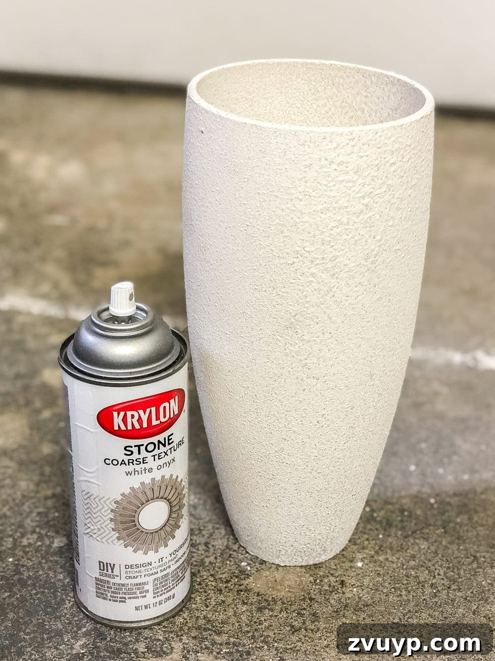 Thrift Store Vase Gets a Stoneware Makeover 5 Applying stone look spray paint to glass vase