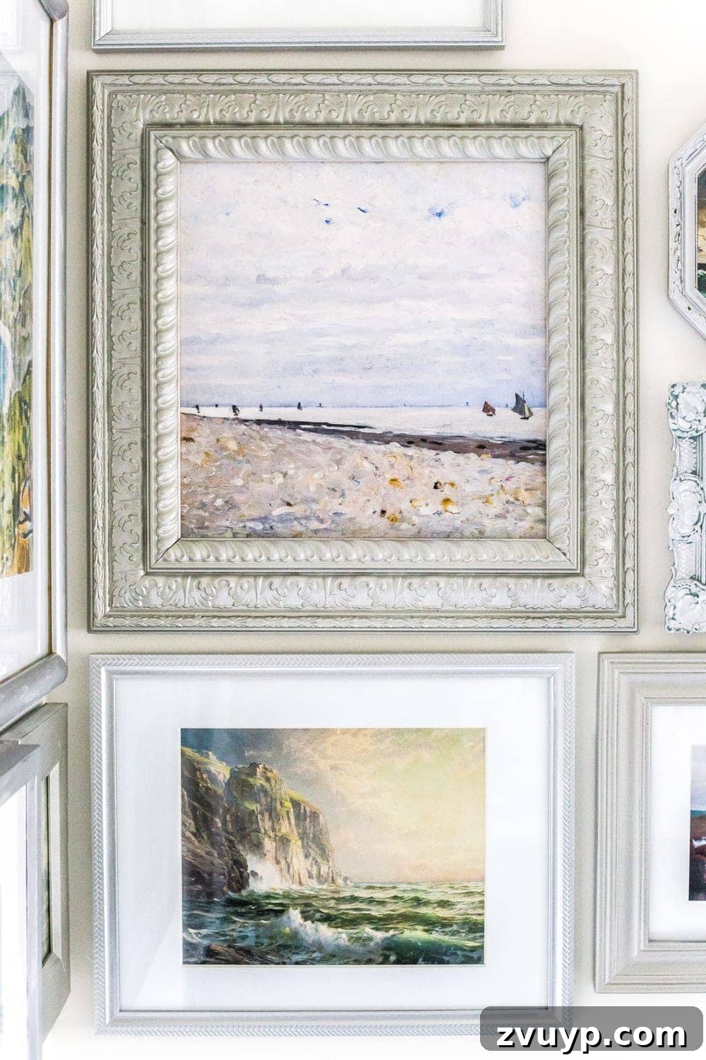 Coastal Charm Printable Art Gallery 11 Finished coastal gallery wall in a bathroom, showcasing antique ocean paintings and thrifted frames. #bathroomdesign #DIYart #affordabledecor #coastalhomes