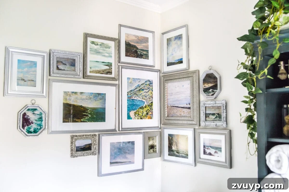 Coastal Charm Printable Art Gallery 4 DIY coastal gallery wall with free ocean prints and upcycled frames to refresh your bathroom decor. #coastaldecor #gallerywall #bathroomart #bathroomwall #bathroomdecor #coastalart