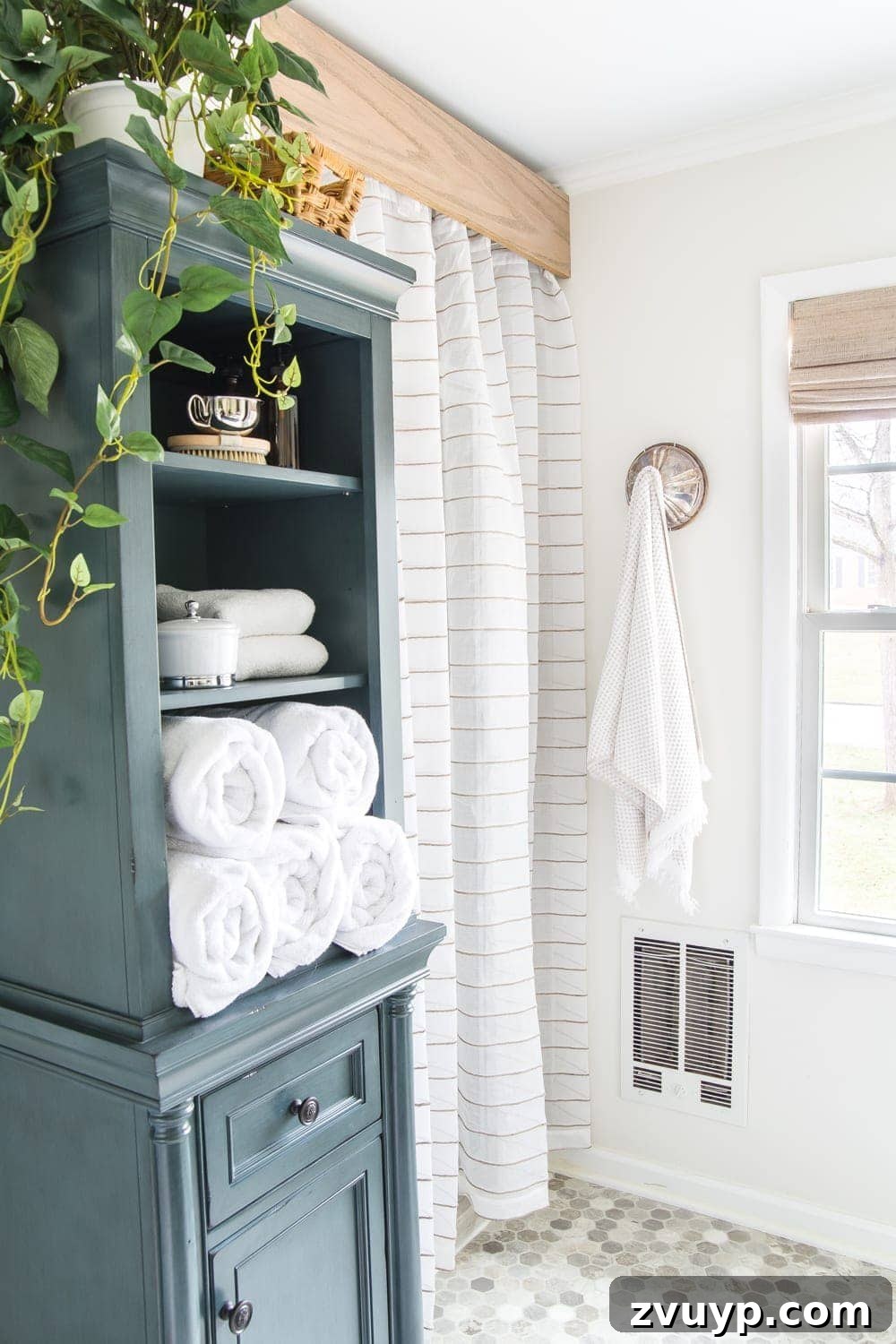 Budget Master Bath Glow-Up Unveiled 13 Budget Master Bathroom Refresh Reveal: Close-up of the semi-sheer curtain and DIY wooden cornice above the shower.