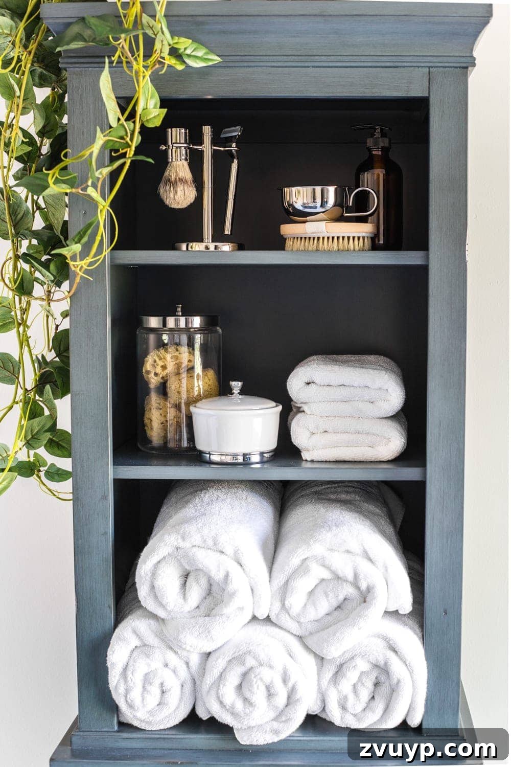 Budget Master Bath Glow-Up Unveiled 20 Budget Master Bathroom Refresh Reveal: Organized linen cabinet with rolled towels and essentials.