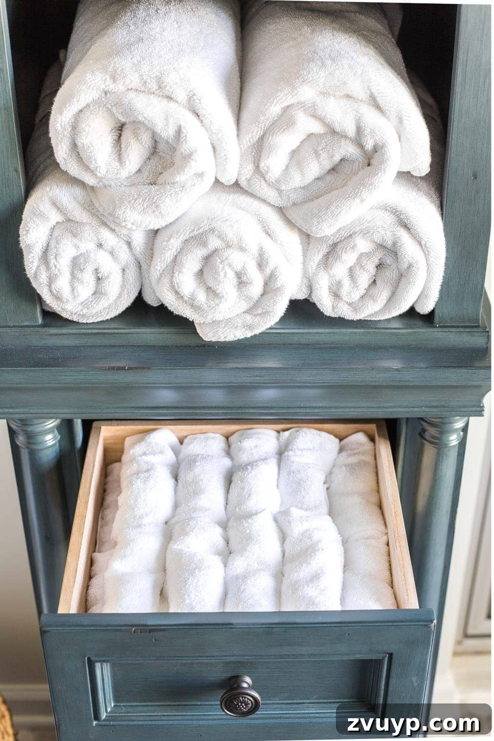 Budget Master Bath Glow-Up Unveiled 21 Budget Master Bathroom Refresh Reveal: Drawer in linen cabinet organized with washcloths.