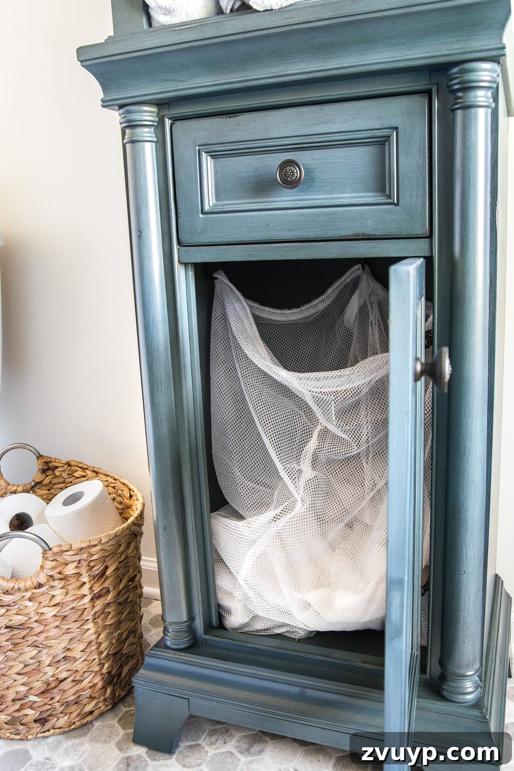 Budget Master Bath Glow-Up Unveiled 22 Budget Master Bathroom Refresh Reveal: Laundry hamper ingeniously hidden inside the linen cabinet.