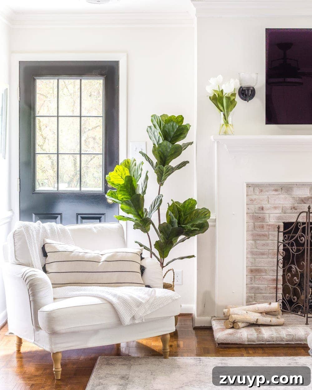 Blooming and Bright: Our Spring Home Reveal 19 Simple Spring Home Tour | Neutral living room decorated with artificial fiddle leaf fig and IKEA furniture