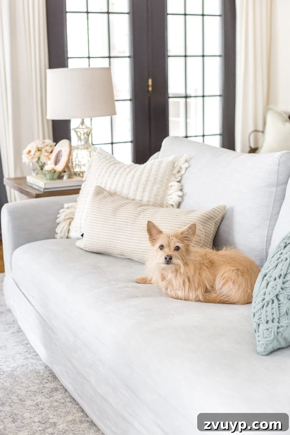 Blooming and Bright: Our Spring Home Reveal 25 Simple Spring Home Tour | Neutral living room with artificial florals and small spring touches.