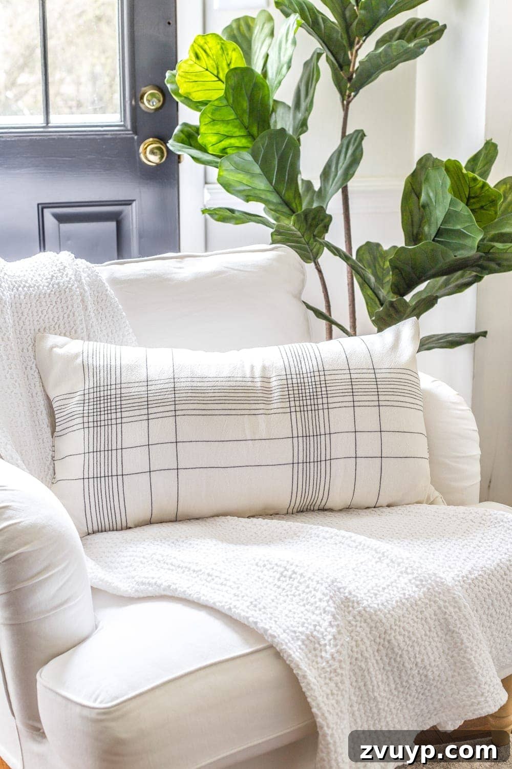 3 Clever Ways to Upcycle Household Items into DIY Throw Pillows 9 A finished DIY no-sew throw pillow made from a kitchen towel, showcasing its elegant appearance.