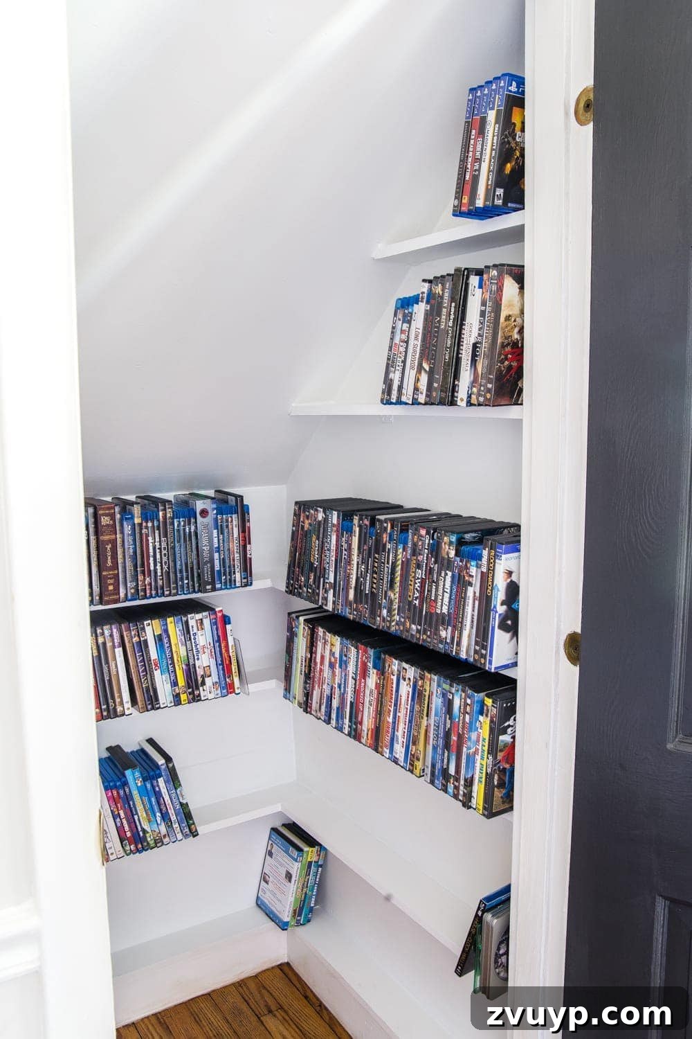 Handcrafted Film Collection Cabinet 11 Under stairs closet after DIY media storage installation