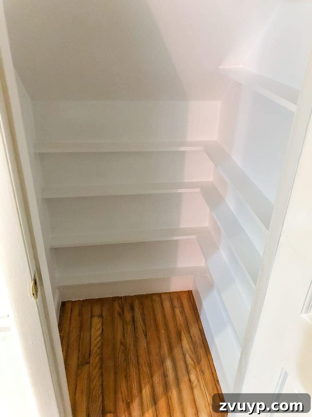 Handcrafted Film Collection Cabinet 9 Finished under stairs DVD shelves after painting