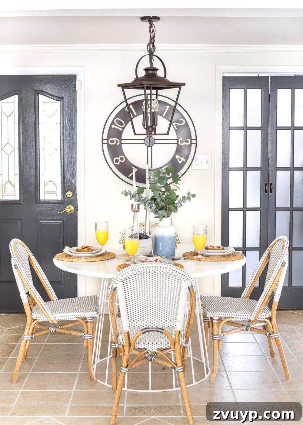 Our Home's Two Year Evolution A Before and After Tour 18 After shot of the bright breakfast nook, featuring a round dining table, minimalist chairs, and abundant natural light, creating a serene ambiance.