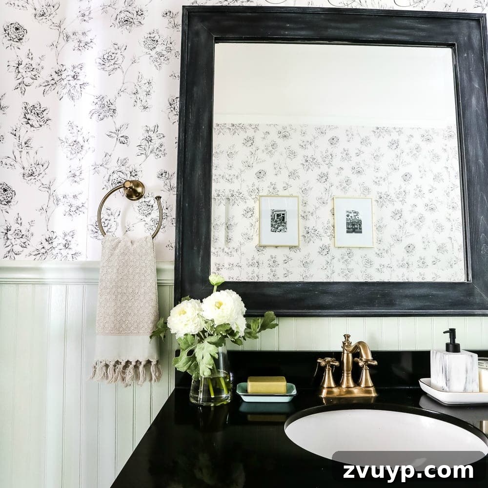 Our Home's Two Year Evolution A Before and After Tour 27 A square crop photo of the powder room, highlighting a decorative mirror and vanity area, perfectly blending Aqua and Urban styles.