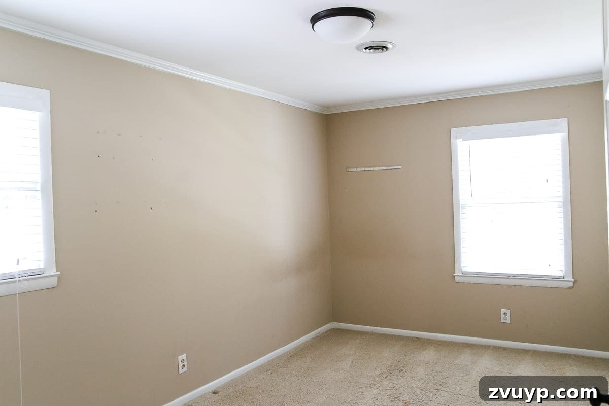 Our Home's Two Year Evolution A Before and After Tour 71 Before shot of the guest bedroom, featuring a neutral palette and basic furnishings, awaiting its transformation.
