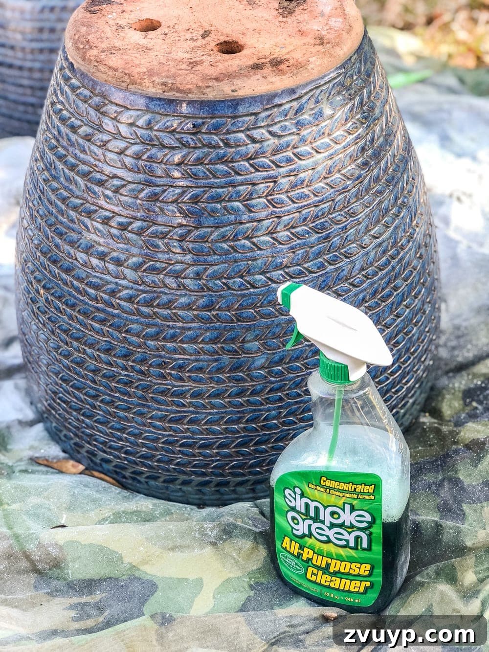 Clean your planters thoroughly before applying the base coat of spray paint for an optimal distressed finish.
