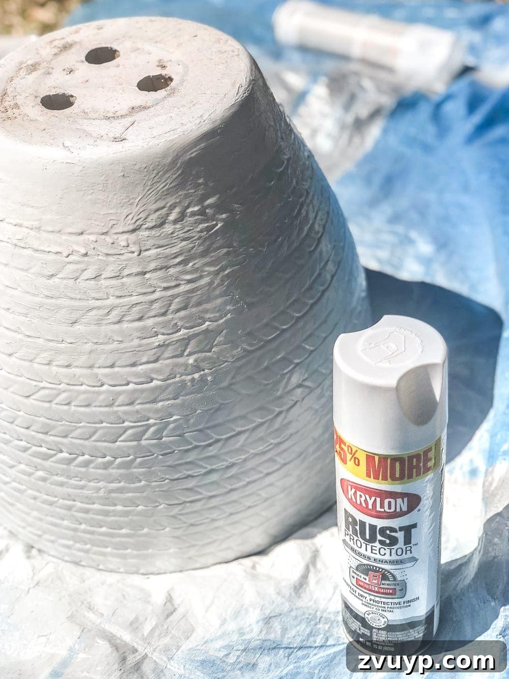 Apply the top coat of spray paint immediately after Vaseline for an authentic distressed appearance.