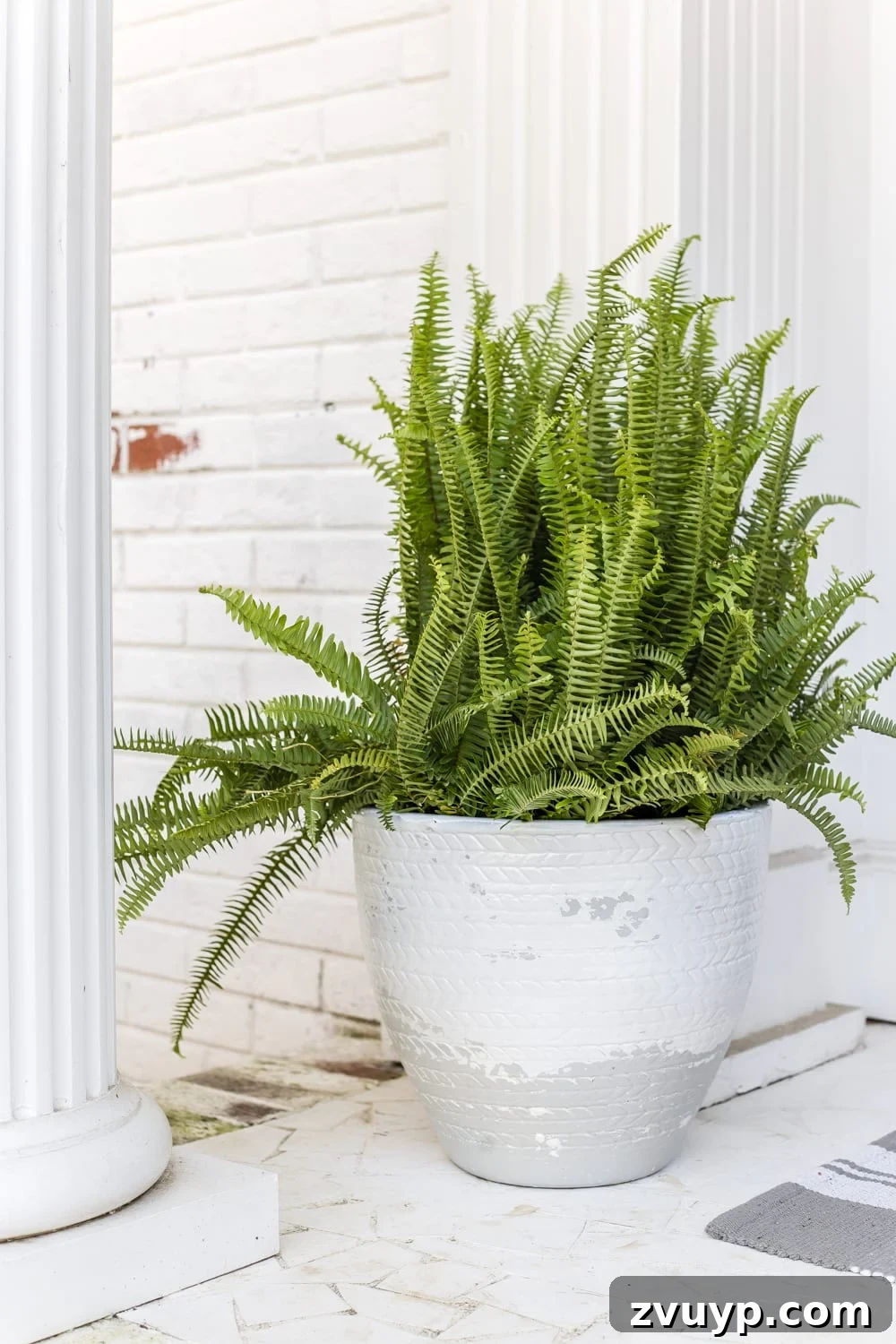 Finished distressed planters with a Pottery Barn inspired Tuscan look, saving hundreds of dollars.
